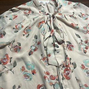 Floral beige design blouse , tie neck.